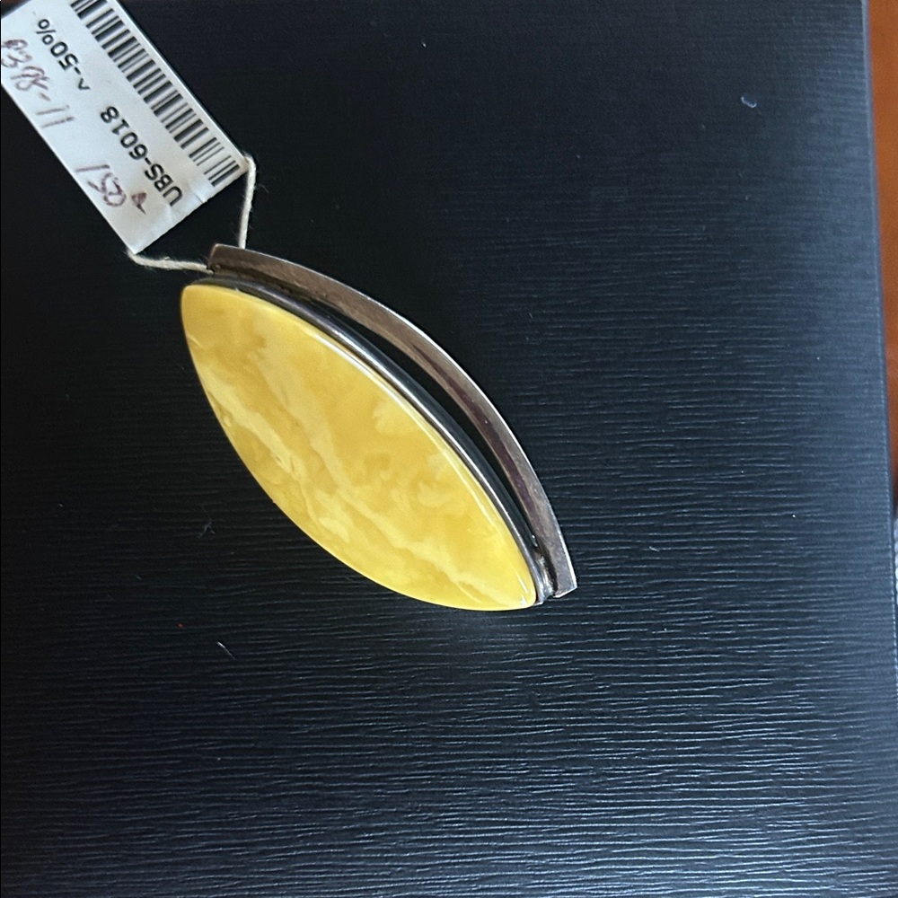 Baltic amber and Silver Pendant on chain.